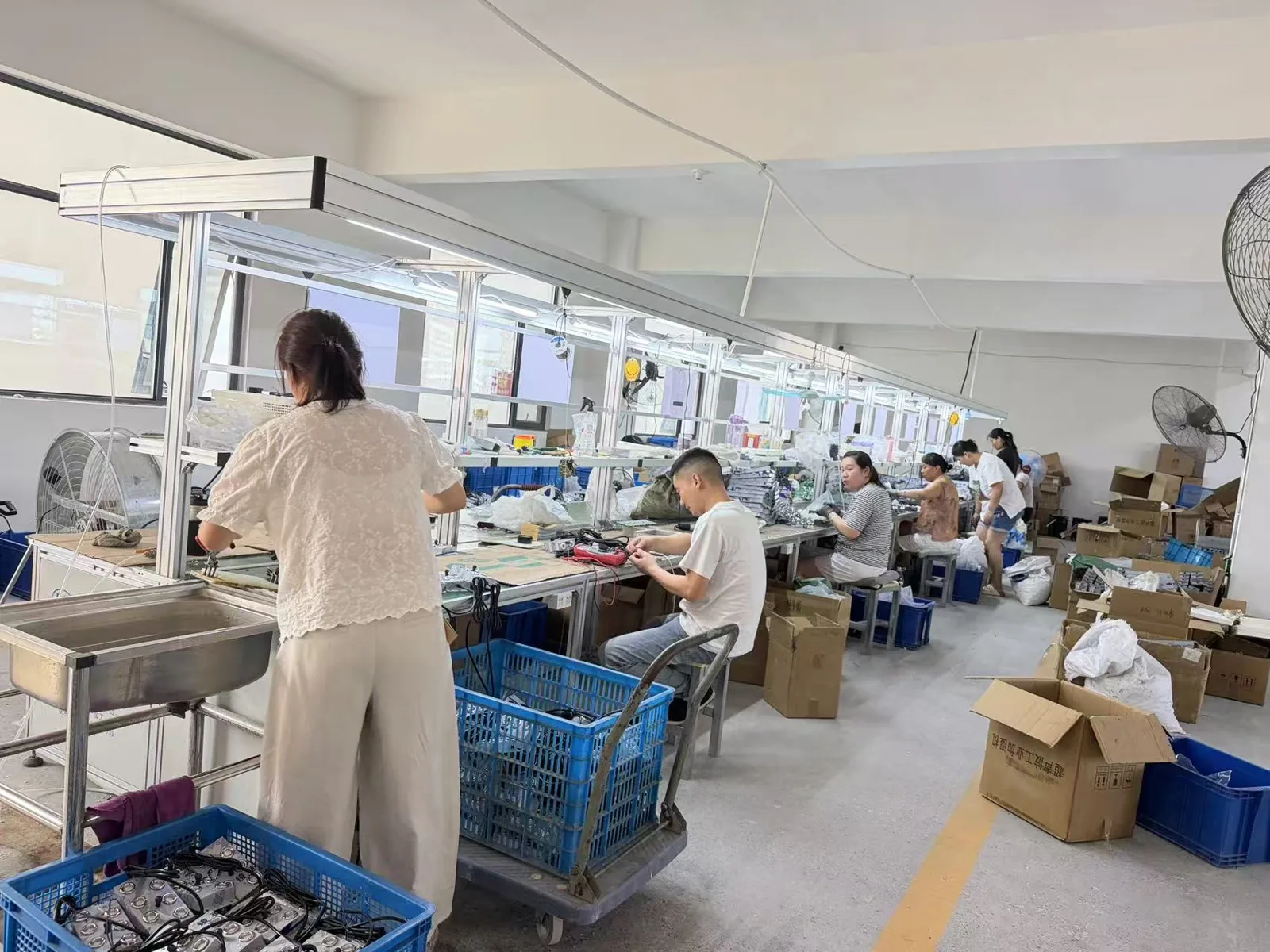 Workers assembling ultrasonic mist maker modules